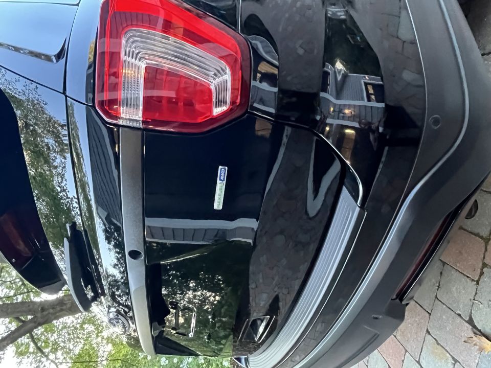 Black SUV rear bumper with 'FlexFuel E85' badge and taillight