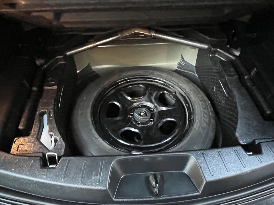 Spare tire in trunk well