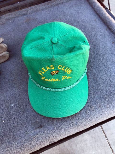 1994 Ford Bronco - A green baseball cap with "FLEAS CLUB Easton, Pa." embroidered on it.
