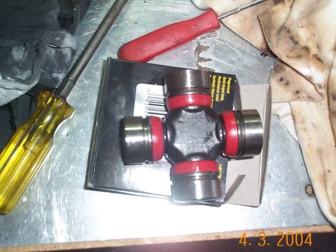 1992 Ford Bronco - This is the u-joint, the end caps pull right off. Be careful with them, as you don't want to mess up the needles.