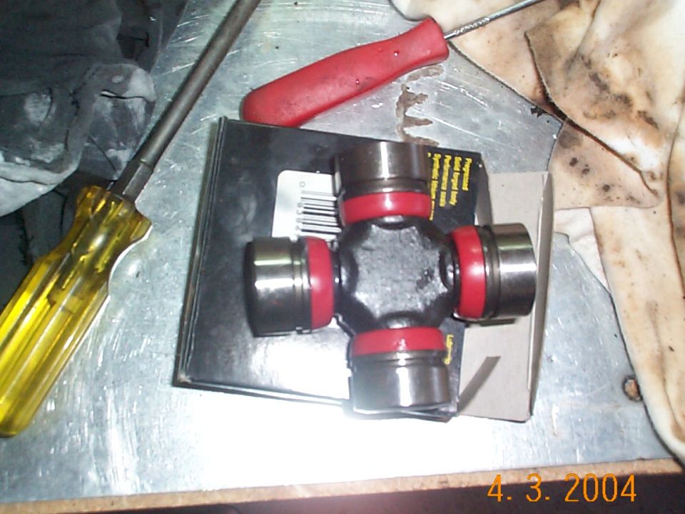 This is the u-joint, the end caps pull right off. Be careful with them, as you don't want to mess up the needles.