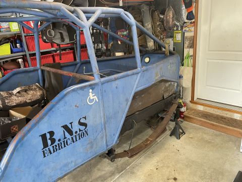 1979 Ford Bronco - A custom-built buggy with a roll cage and "B.N.S. Fabrication" lettering is shown in a garage setting.