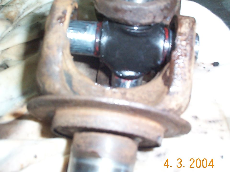 After removing the caps, I positioned the u-joint betweent the two axle pieces. You may have to work it around a little to get it to fit.