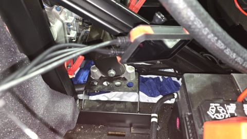 2025 Polaris RANGER - A dash cam mount is visible with wires and a battery in this close-up view.
