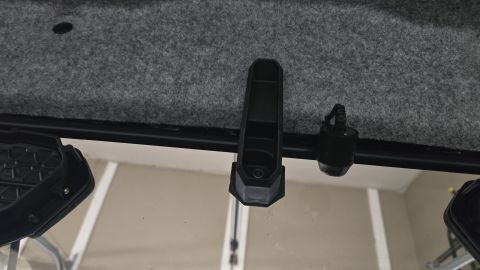 2025 Polaris RANGER - Interior view of a vehicle's roof lining and windshield frame, showing accessory mounts.