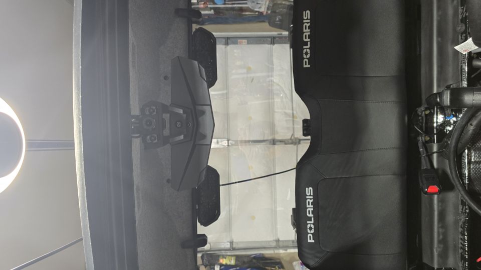 Polaris side-by-side vehicle parked in a garage