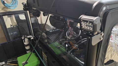 2025 Polaris RANGER - Aftermarket LED light bars and accessories installed in the interior of a utility vehicle.