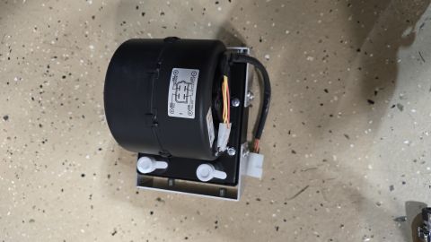 2025 Polaris RANGER - A heater blower motor assembly, likely for an aftermarket kit, is shown with its electrical connections and mounting hardware.