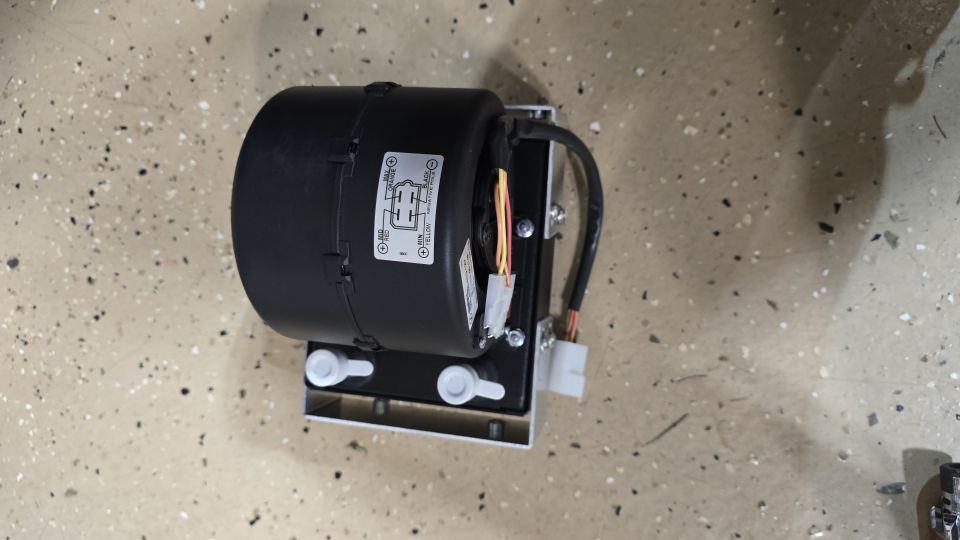 Heater blower motor assembly with wiring harness and mounting bracket