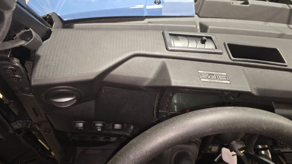 Close-up of UTV dashboard with vents, switches, and an EPS badge