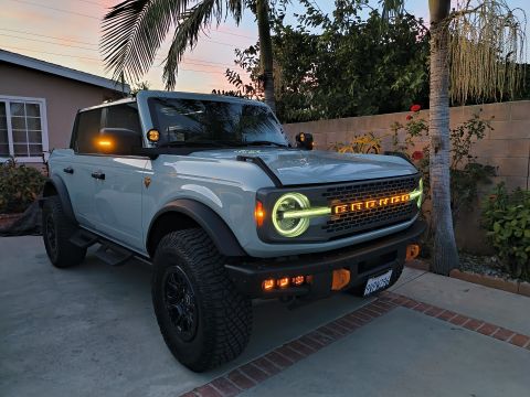 2023 Ford Bronco - 2023 Ford Bronco's front end features illuminated BRONCO lettering and distinctive lighting elements.