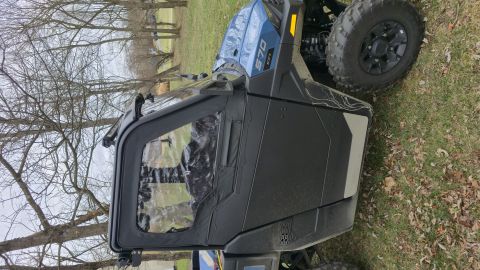 2025 Polaris RANGER - A side-by-side utility vehicle with a "570" badge is parked outdoors.