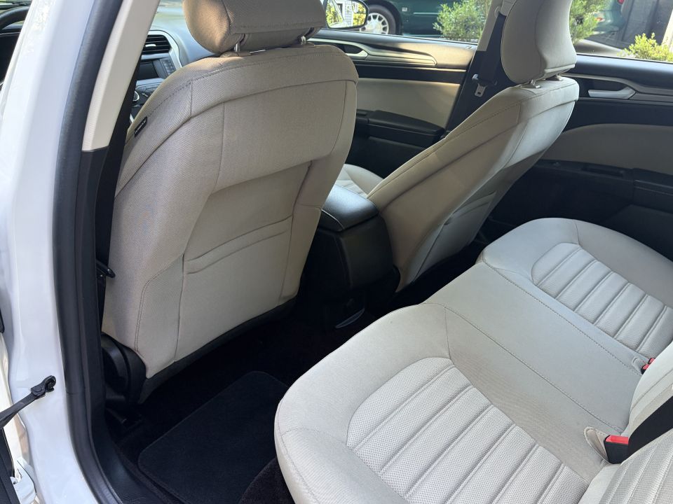 Ford Fusion rear seats in tan cloth, door open