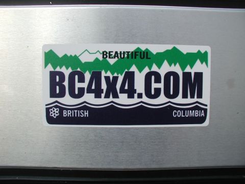 1985 Ford Bronco - A sticker that reads "BEAUTIFUL BC4X4.COM BRITISH COLUMBIA" is affixed to a metallic surface.