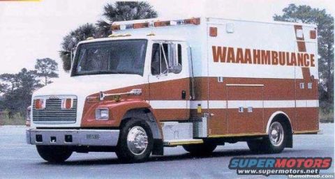 1985 Ford Bronco - A white and red ambulance with "WAAAAAHMBULANCE" written in large red letters on the side is parked on an asphalt surface with trees in the…