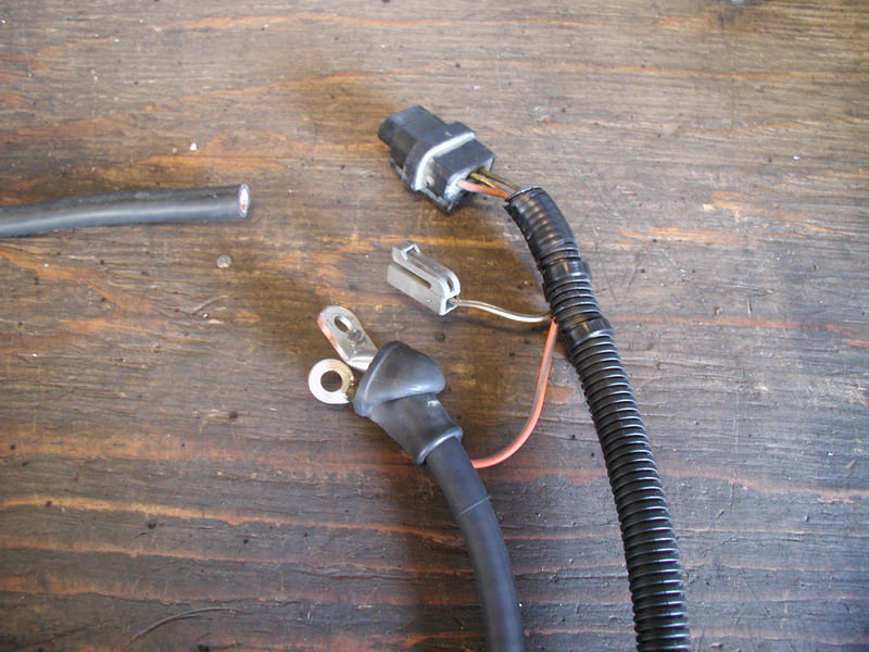 I had the Taurus wiring harness, which got me the plug and the boot for the charge cable.