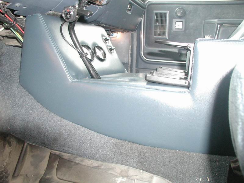 Side profile of custom blue vinyl center console in a Ford Bronco interior