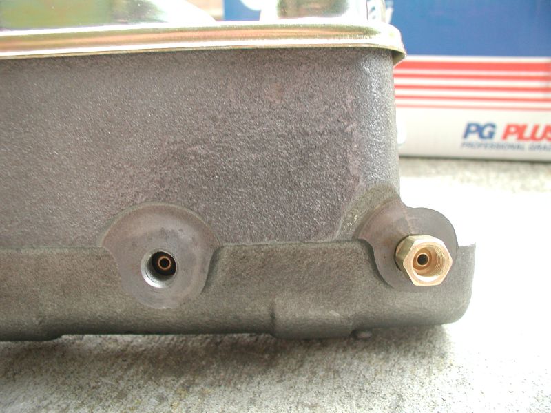 Gray brake master cylinder with brass fittings and PG PLUS box in background
