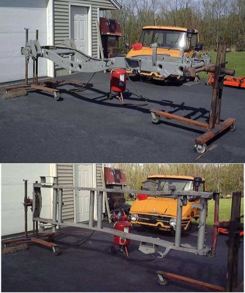 1985 Ford Bronco - The chassis of an orange vehicle is mounted on a rolling stand in front of a garage. A red sandblaster is positioned near the chassis.