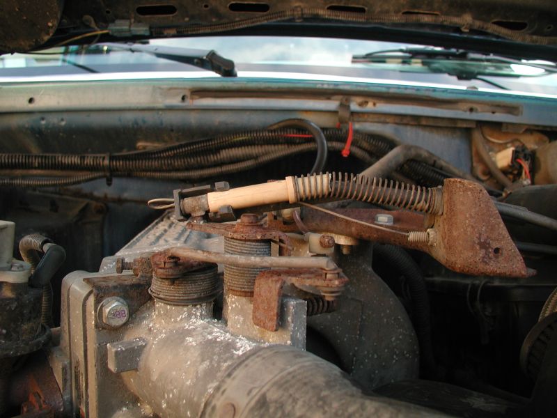 I ended up getting the shifter cable for a tandem bike. I ran the cable along side the accelerator cable, then through the plastic piece on the throttle body and tied it off with a crimp fitting.