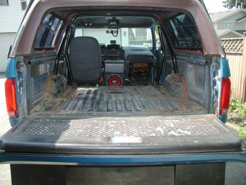 1985 Ford Bronco - Vacuumed out all the leaves and branches and dirt and loose rust.