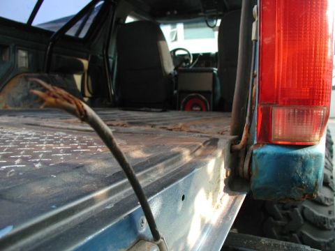 1985 Ford Bronco - The right cable broke when I was cleaning out the back earlier.