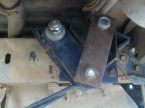1988 Ford Bronco - Detail of rusty suspension components and hardware, likely from a truck or SUV.