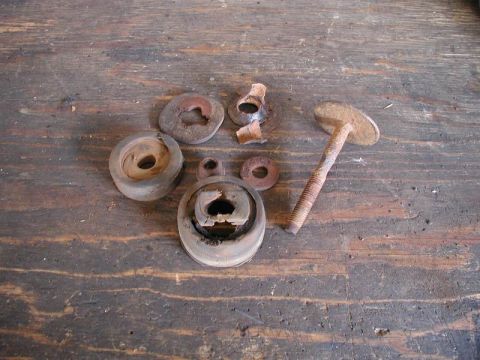 1985 Ford Bronco - What was left of the left body mount hardware.