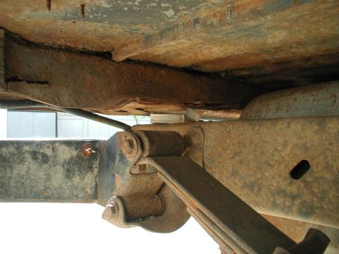 1985 Ford Bronco - I ground the head off the bolt and pounded it through from the top, then I put some wood in place of the bushing to support the body.