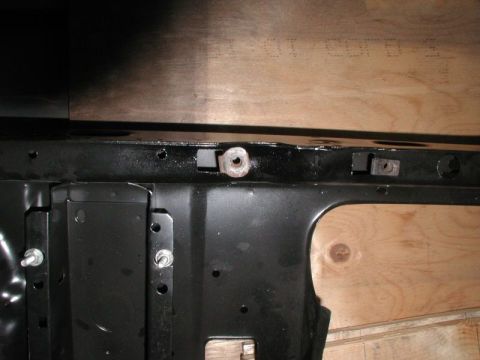 1985 Ford Bronco - The left radiator mount nut after making the holes.