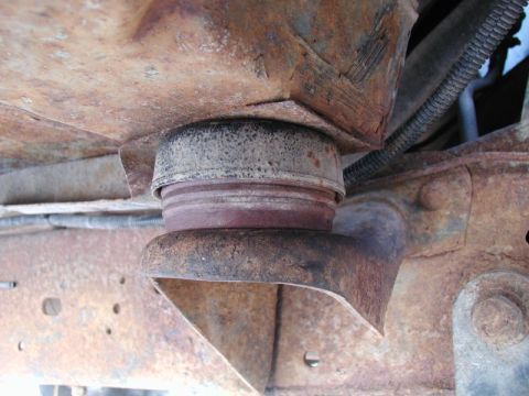 1985 Ford Bronco - The two front cab mounts with the Super Duty rubbers in place; with full weight on them, they compressed to 1 15/16". I had to trim the bot…