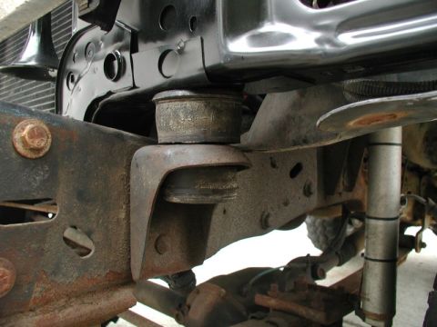 1985 Ford Bronco - Rad support mounts in place. I had to trim down the shoulder a lot, as the factory hole was narrow and almost oval shaped.