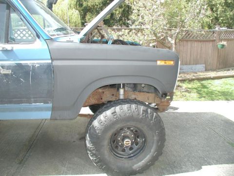 1985 Ford Bronco - Lower part of fender trimmed to clear the bumper. I re-adjusted the fit of the fender, but it is as good as it can get.