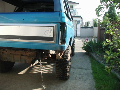 1985 Ford Bronco - The wiring for the tail lights runs through the crossmember that is being cut, so I figured I should get it out of the way.