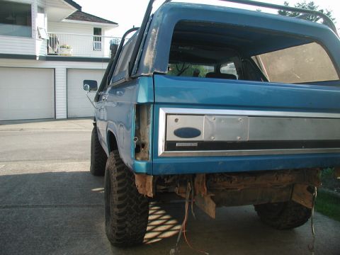 1985 Ford Bronco - The wiring for the tail lights runs through the crossmember that is being cut, so I figured I should get it out of the way.