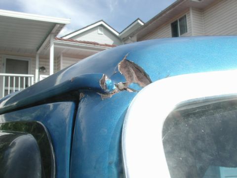 1985 Ford Bronco - Passenger side, front of rain gutter.