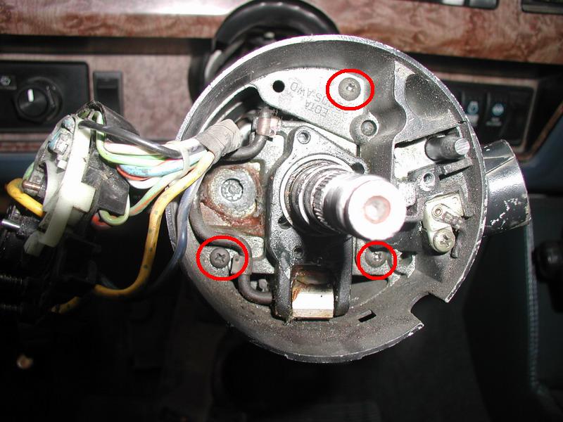 Undo the three screws and slide off the upper cover.