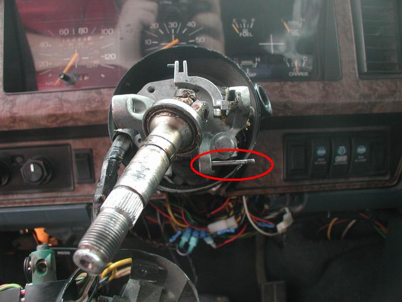 I thought I needed to drive out this lock pin that the tilt jaw (see next picture) locks onto, but it turns out that you can press upwards on the tilt jaw and pull outwards to clear the pin.