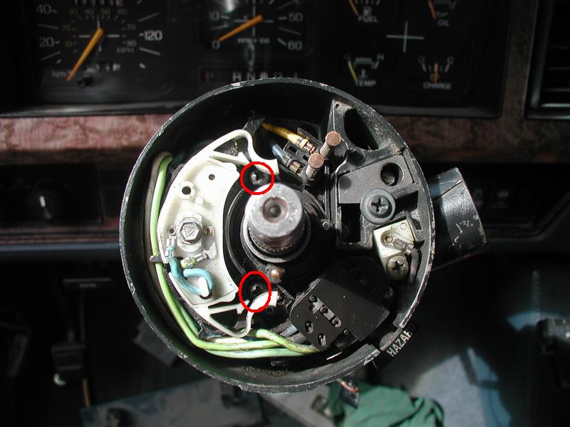 Slide the signal switch on and tighten the two screws.