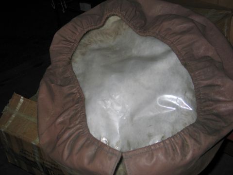 1995 Ford Bronco - A brown car cover with an elasticized edge and a clear plastic window is shown, likely for protecting a vehicle part.