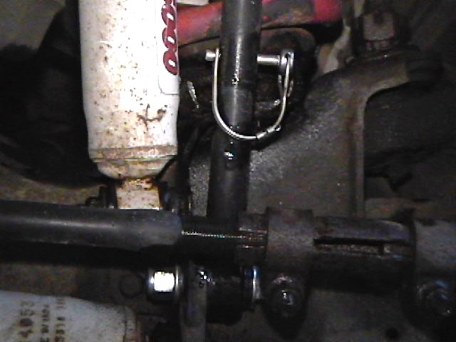 Close-up of steering linkage and shock absorber on a 1985 Ford Bronco