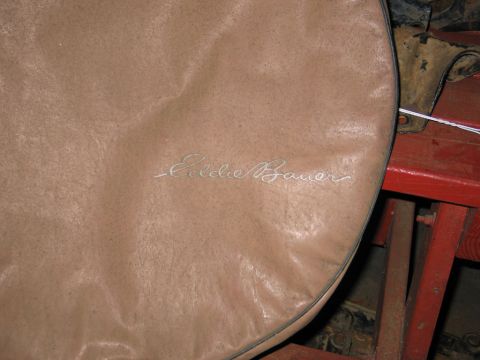 1995 Ford Bronco - The embroidered logo on this tire cover indicates it is an Eddie Bauer branded accessory.