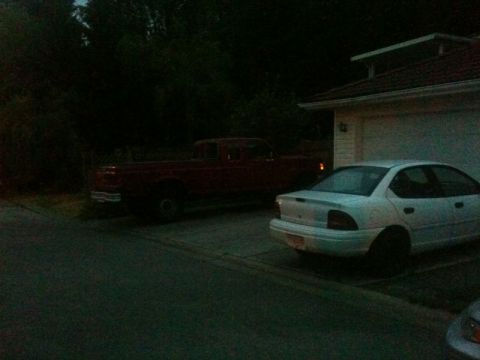 1985 Ford Bronco - I had barely finished sweeping the driveway before Clifford forced his way in to his new parking spot.