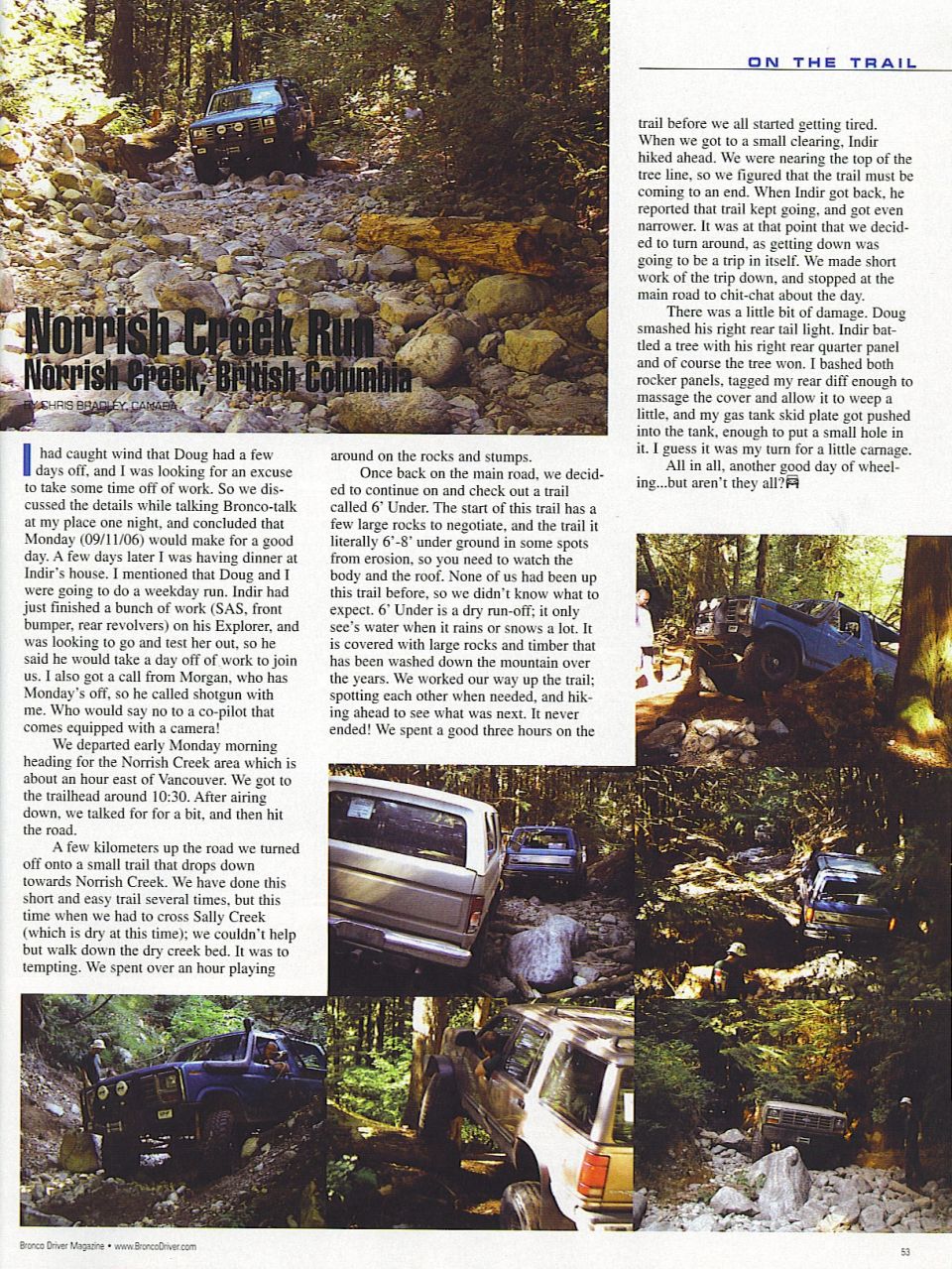 Blue 1985 Ford Bronco driving on a rocky, wooded trail.