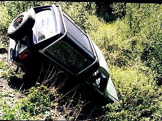 1985 Ford Bronco - After we winched the Bronco onto her wheels (kind of). Nice dent in the roof.