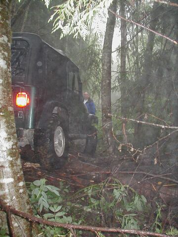 1985 Ford Bronco - A tug to the front, then to the rear and John has some room again.