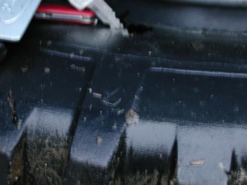 1985 Ford Bronco - Got a gash in the right rear tire.