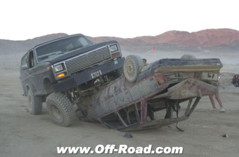 1967 Ford Bronco - Two vehicles involved in an off-road incident in a desert environment.