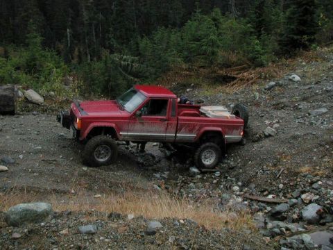 1985 Ford Bronco - Doug got hung up on his bumper and spare tire going through this cross-ditch.