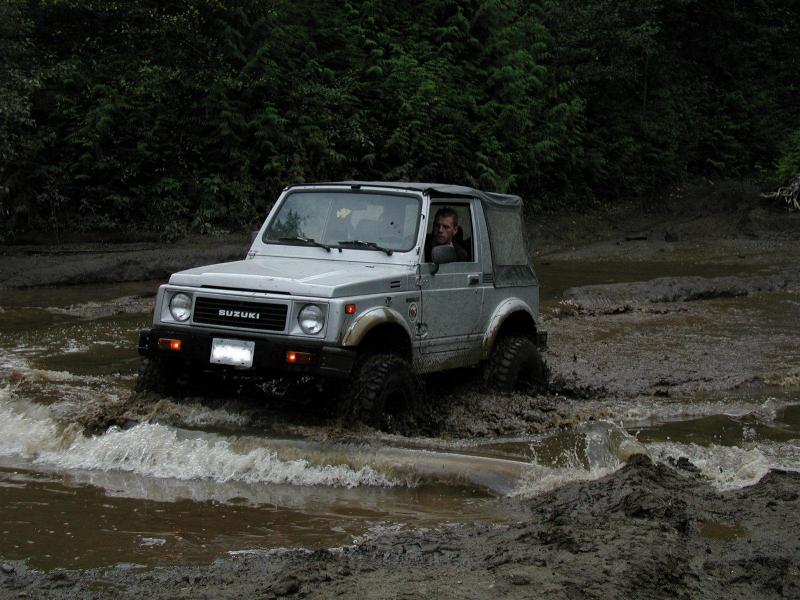 Pete playing in the mud puddle.